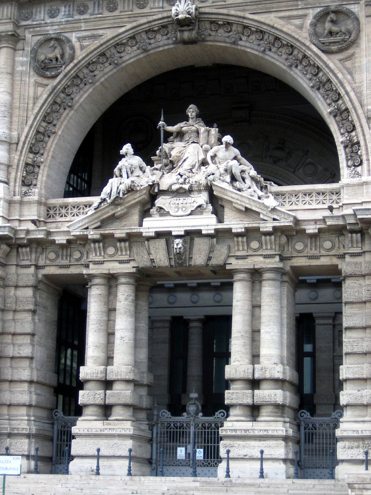 a large building with some statues on the front