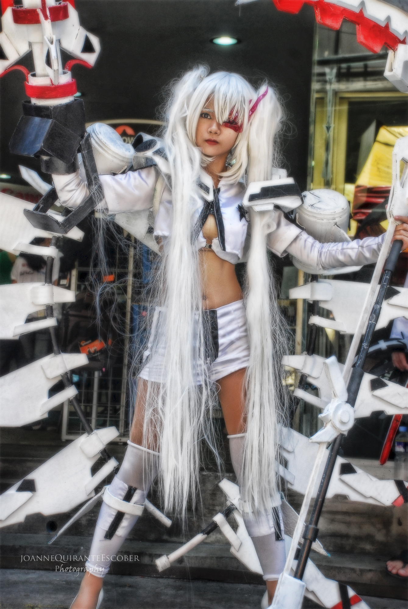 a woman dressed up in cosplay with swords