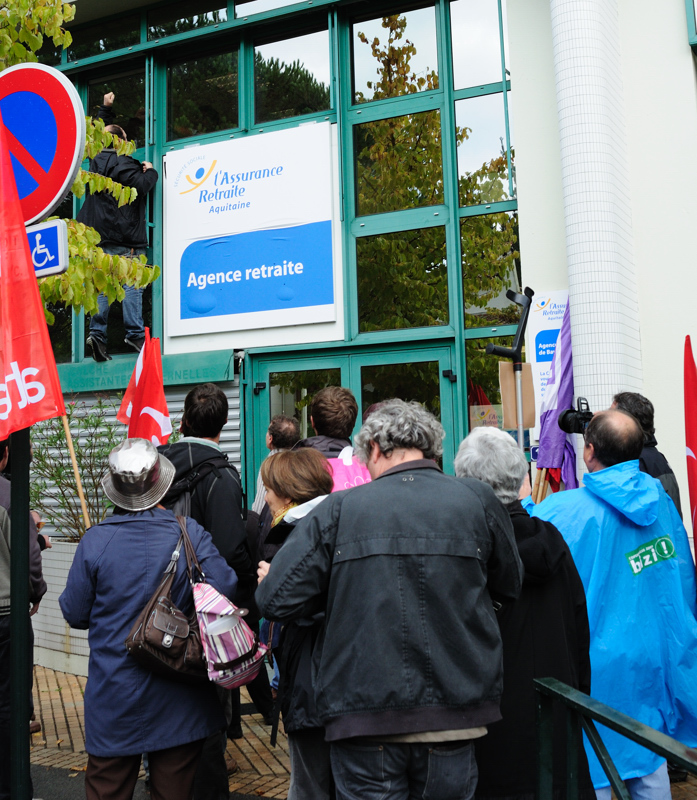 a group of people outside an office building