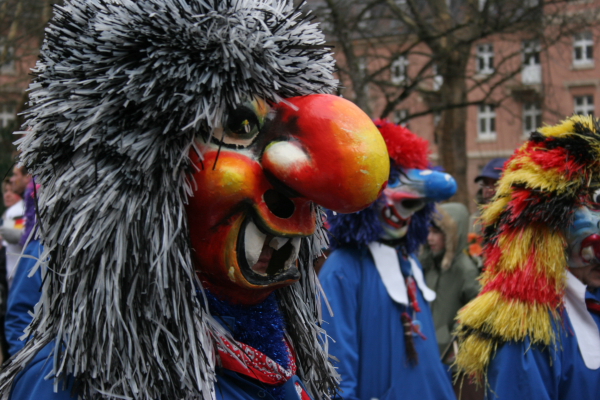 a number of people in costume with animal heads on