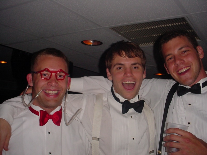 three men are dressed up and having fun