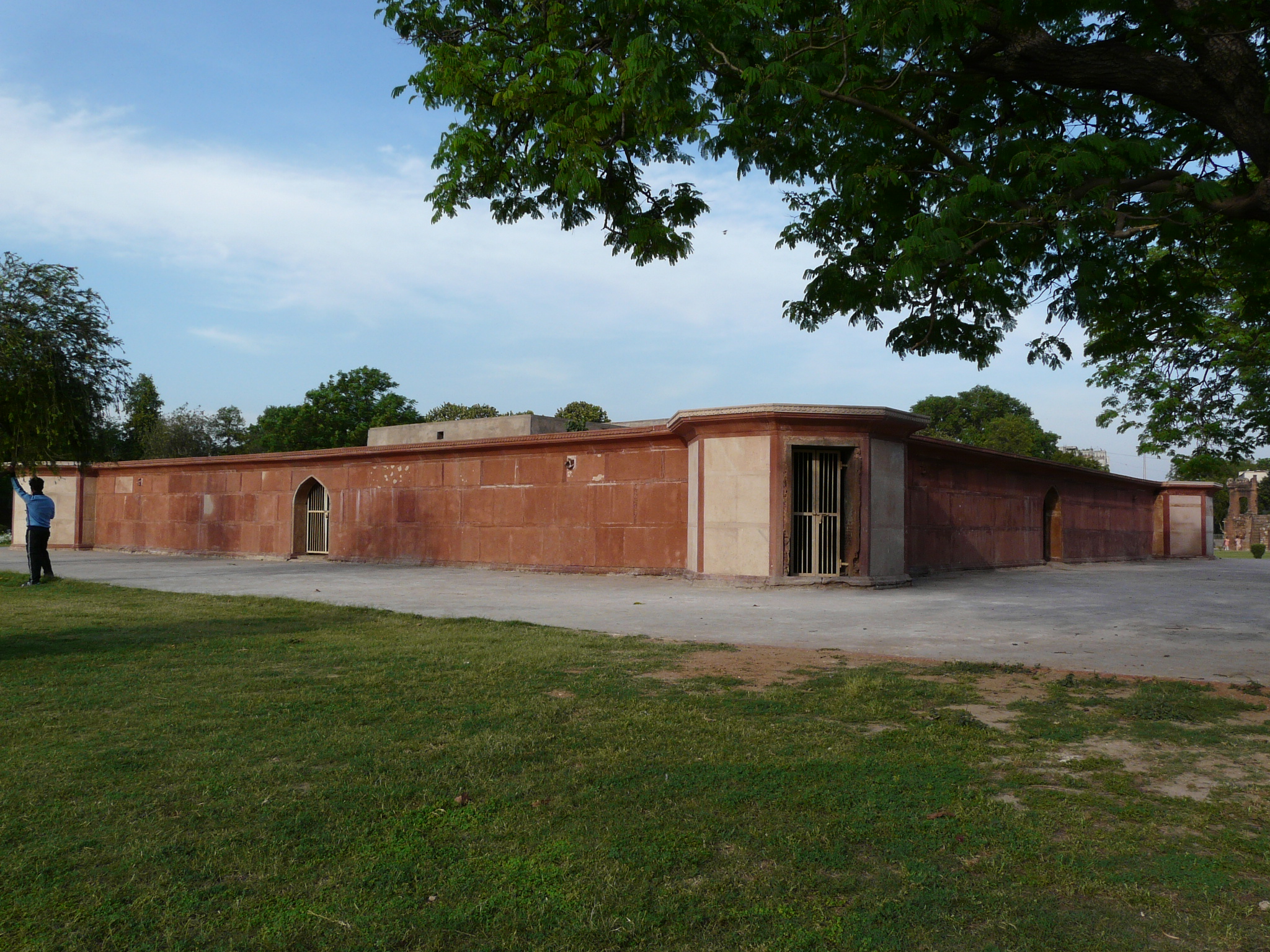 an old building that has no windows and is near a field