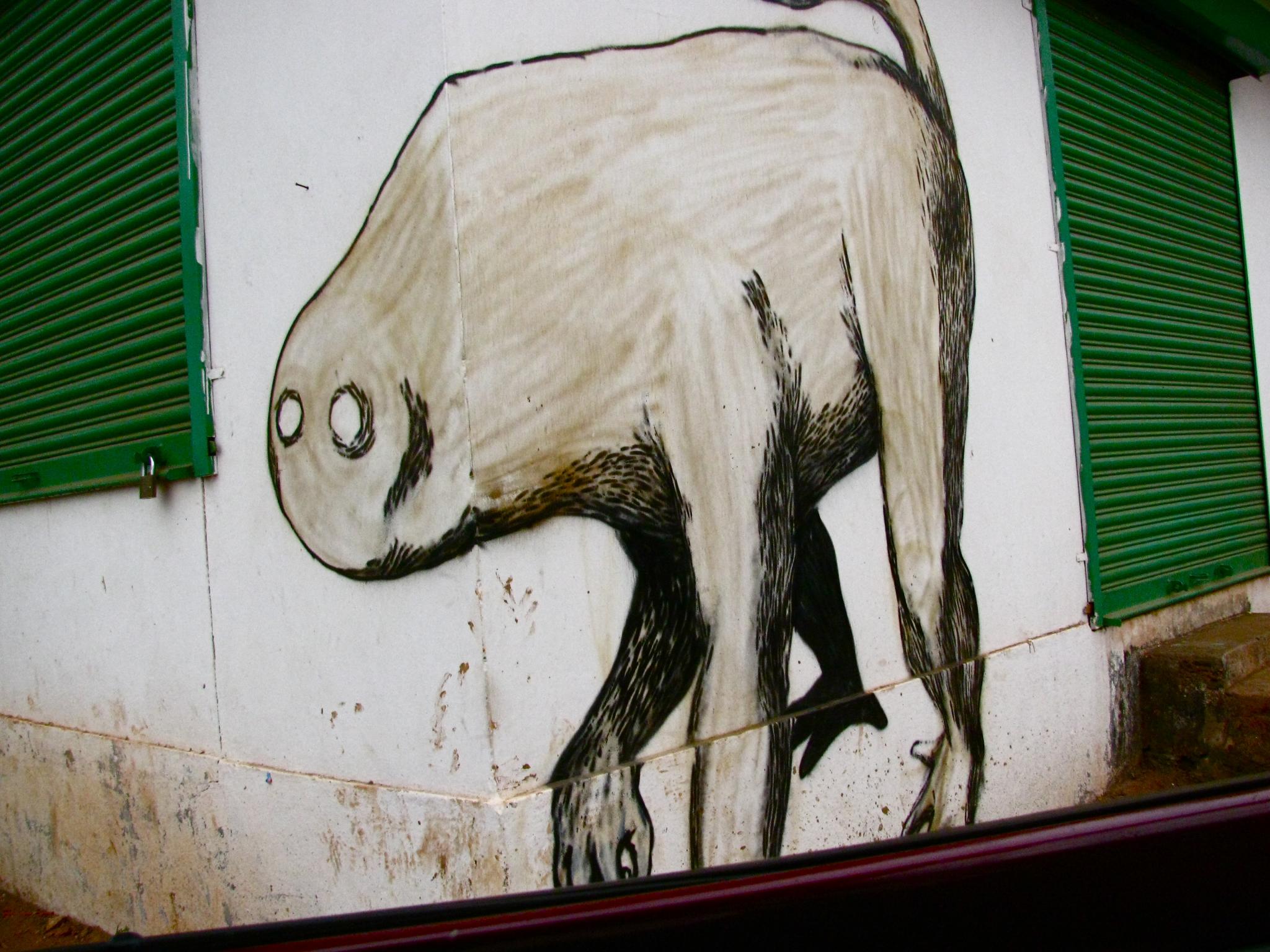 a painting of a white bear is painted on a wall