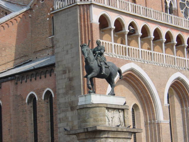 a statue of a horse is seen outside of a building