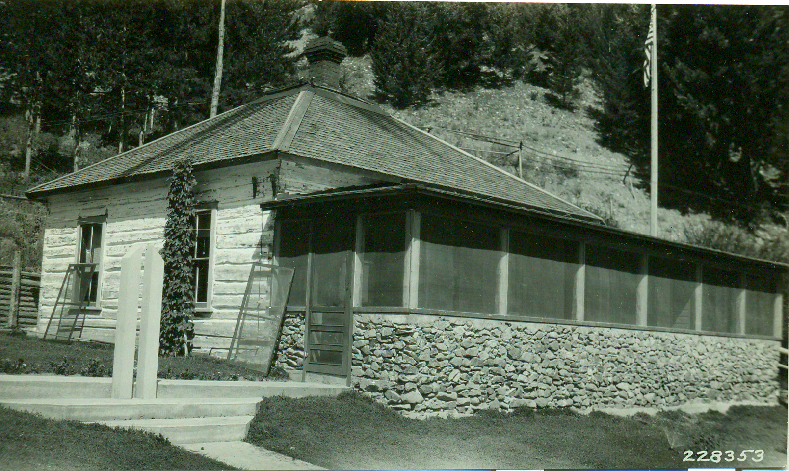 an old black and white po of a brick building with a clock