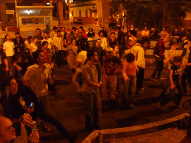 crowd of people playing games and having fun at night