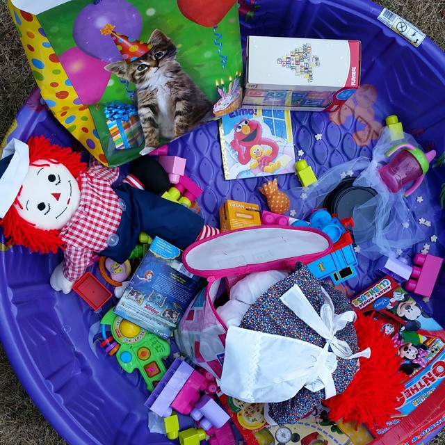 a toy bucket full of children's toys