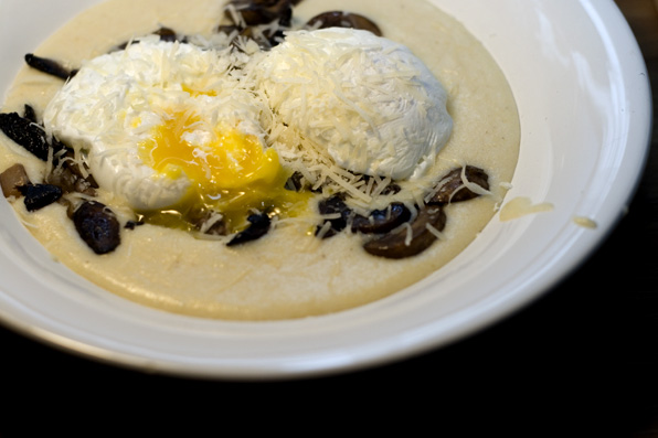 two eggs with grated cheese are served on a tortilla
