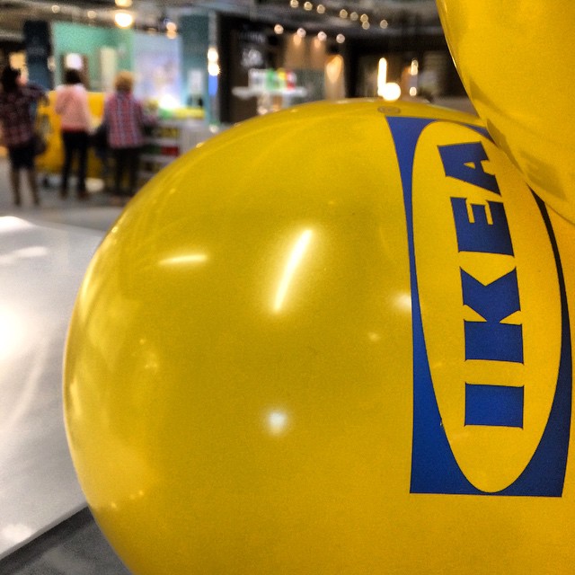 yellow balloons are on display inside a building
