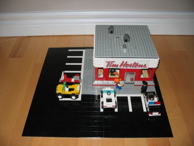 a lego fire station on the floor of a room