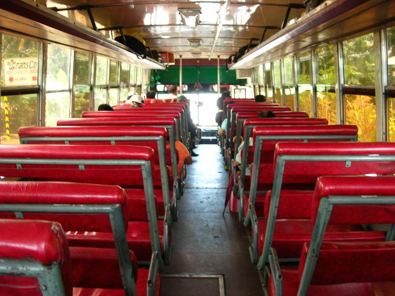 the interior of a train car full of seats
