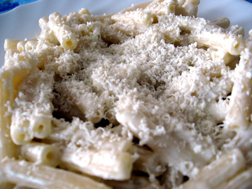 closeup of plate of uncooked pasta with sauce