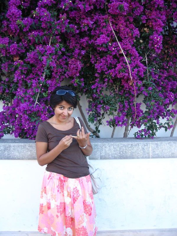 an african american girl in front of flowers