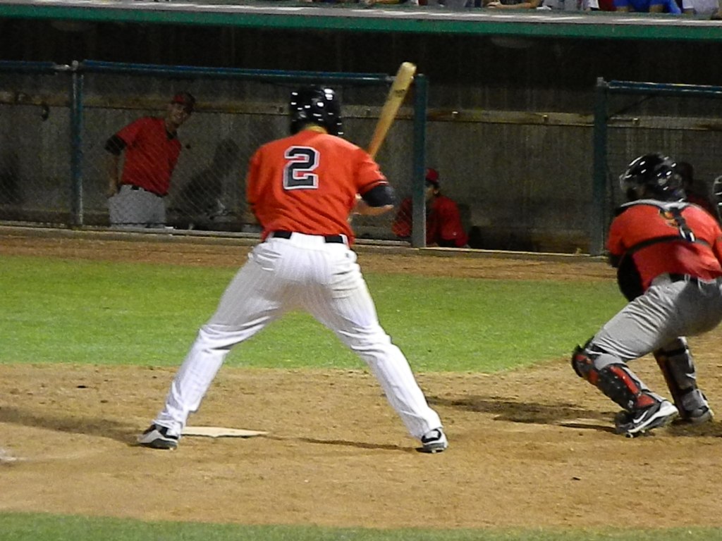 a baseball player preparing to bat during a game