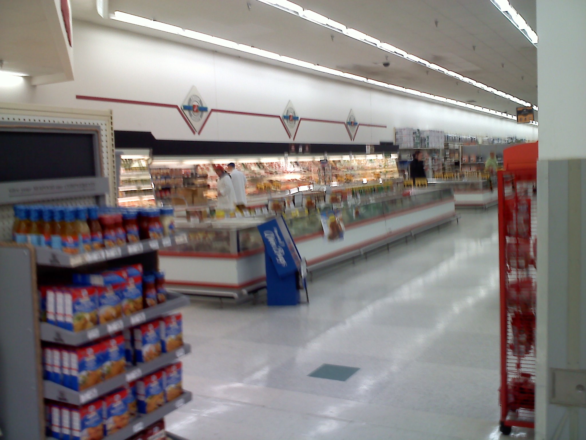 the produce section of a grocery store with empty shelves
