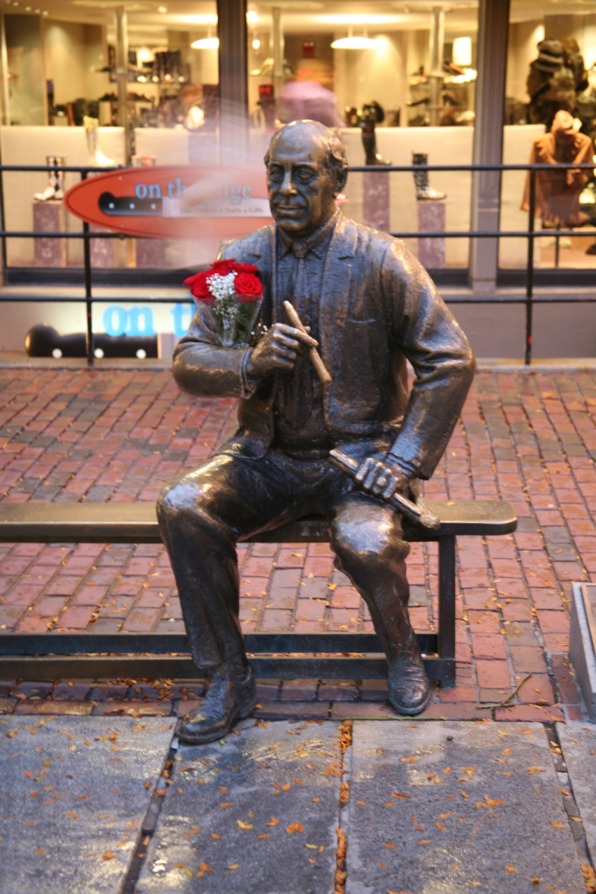 the statue is holding a bouquet of flowers