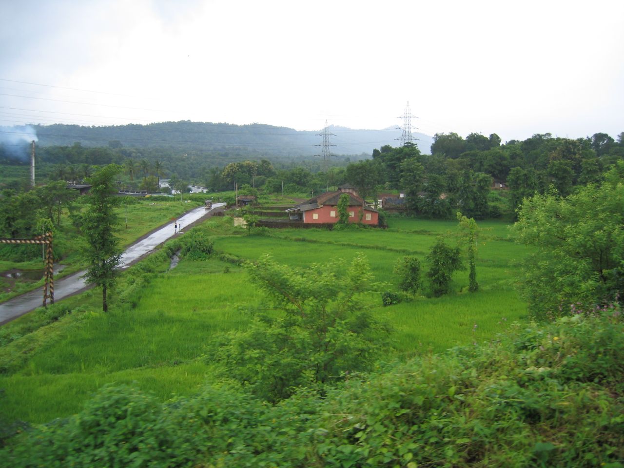 the lush green countryside overlooks an overcast day