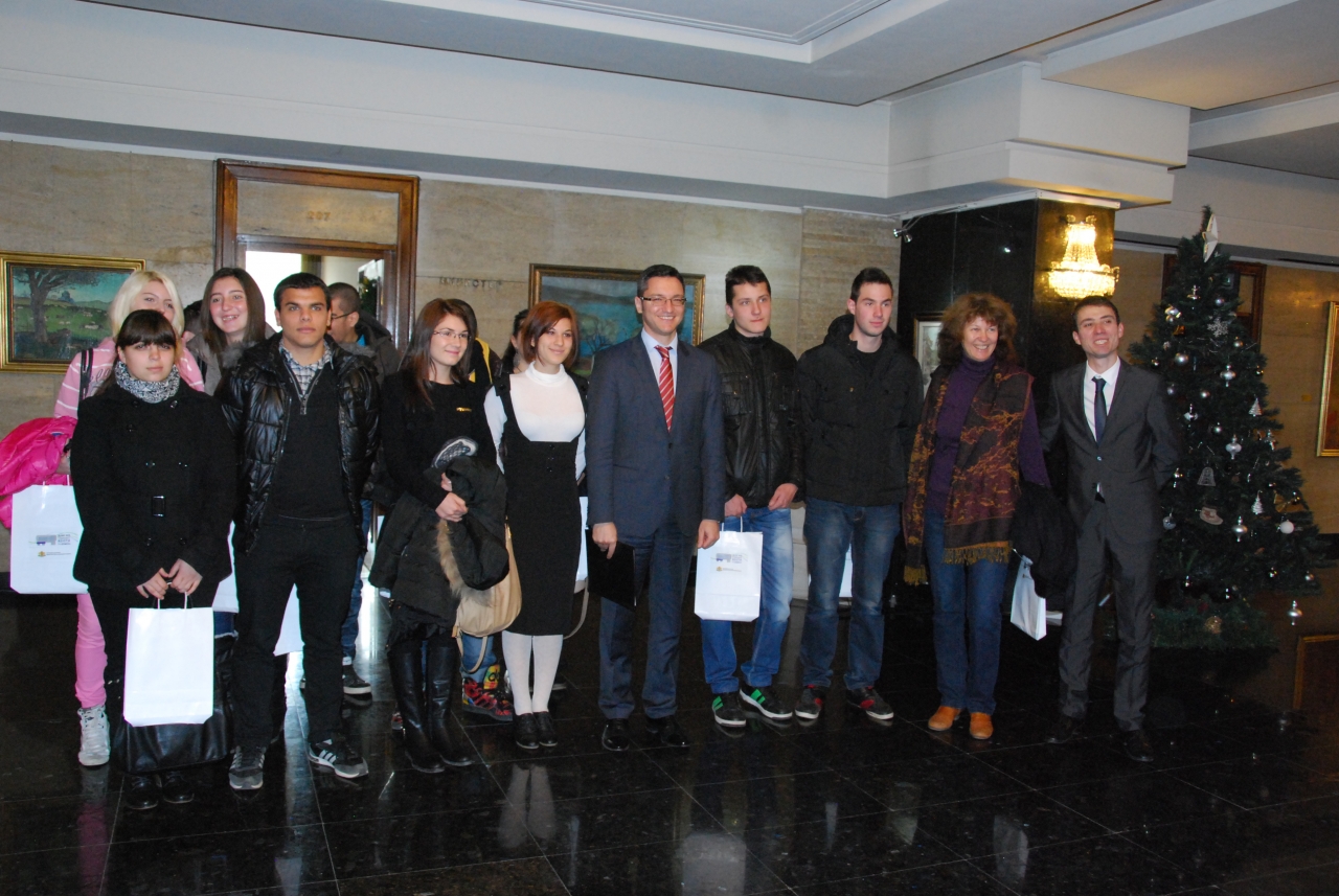 a group of people in line at the lobby of a building