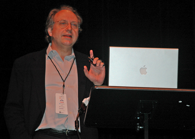 a man giving a lecture during an apple event