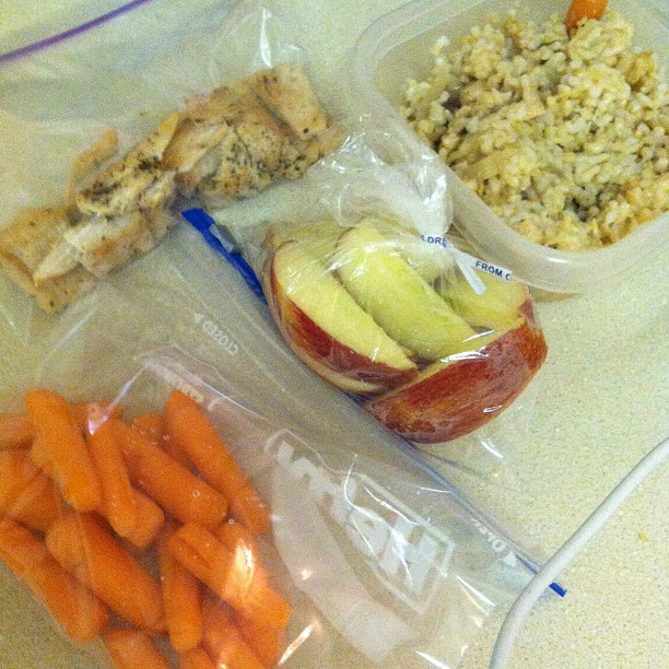 the food has carrots, apple and quiche in its pouch
