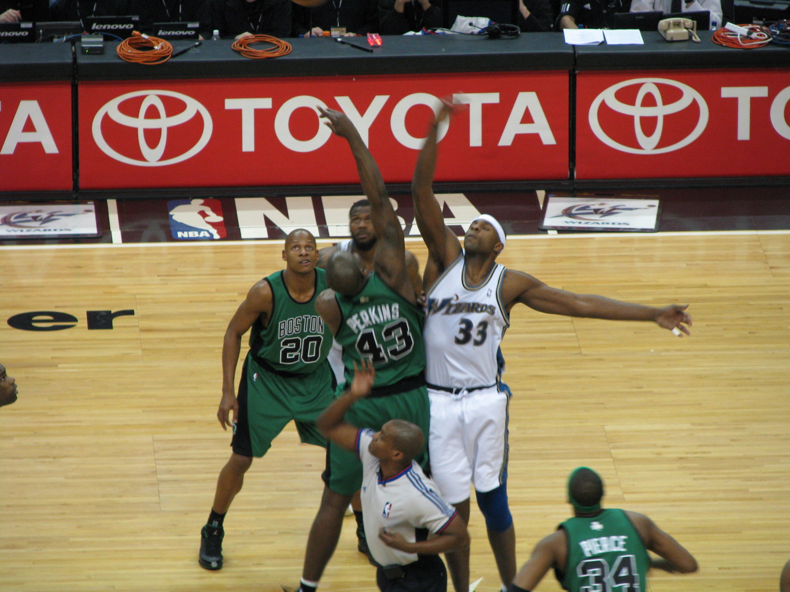basketball players compete in the middle of a ball game