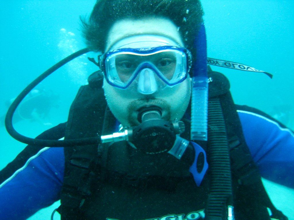 a man is scubang in the water with some equipment