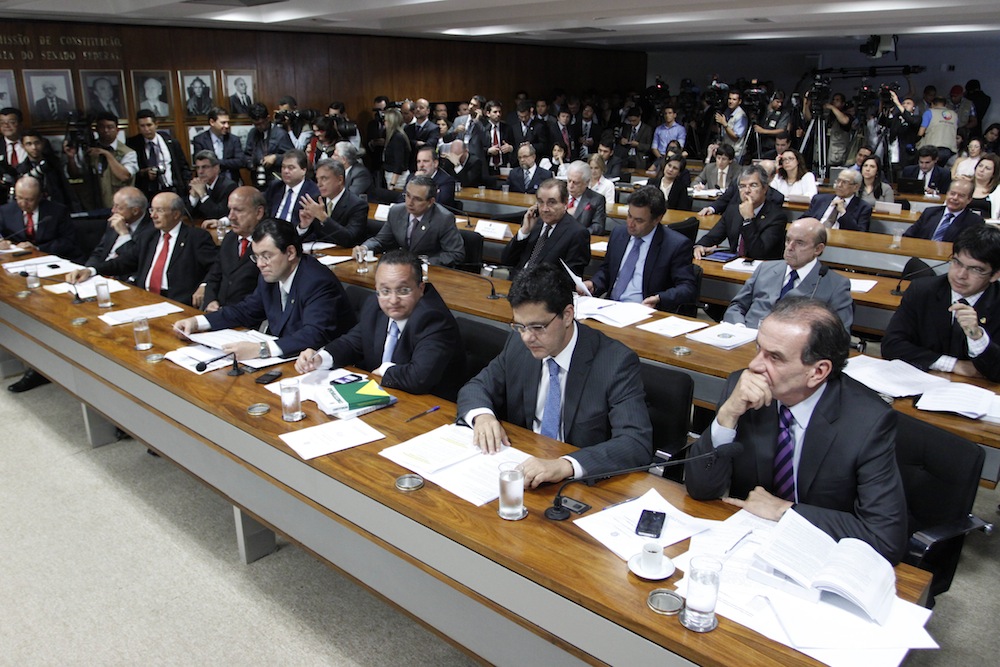 a large group of men sitting at desks