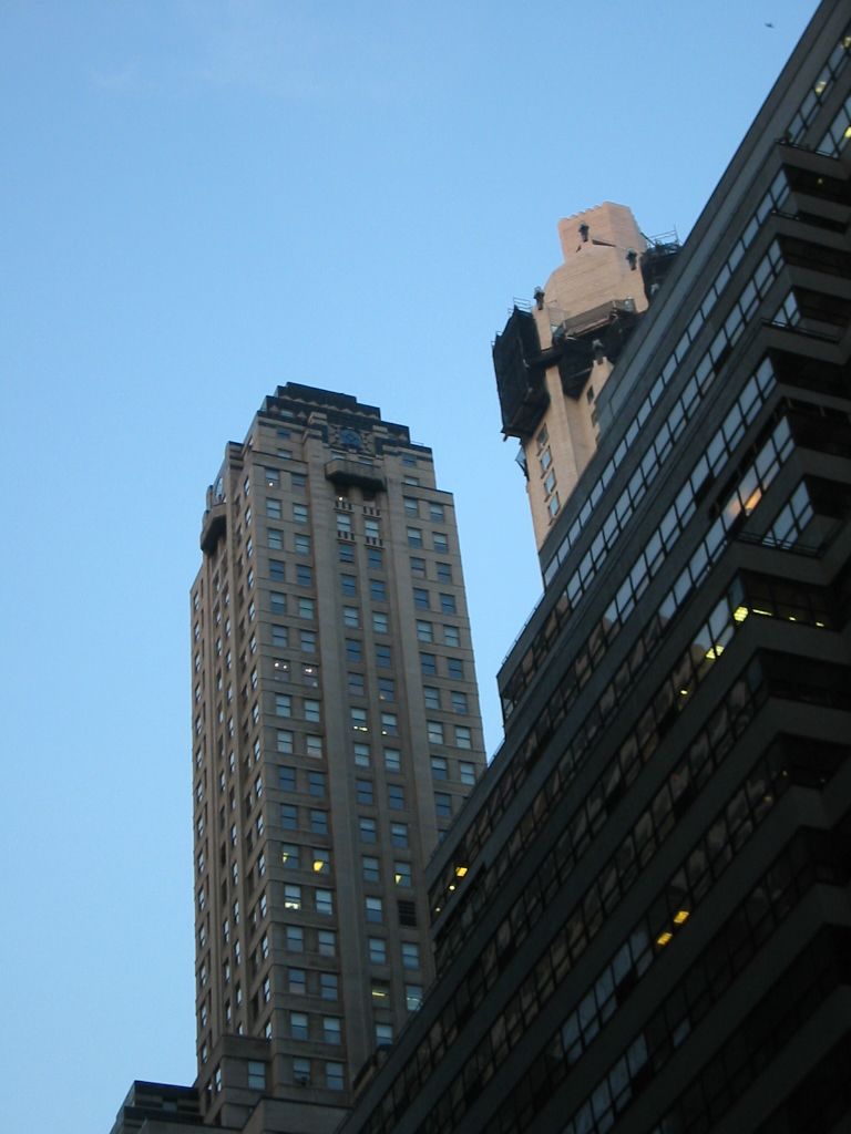 some very tall buildings with windows in them