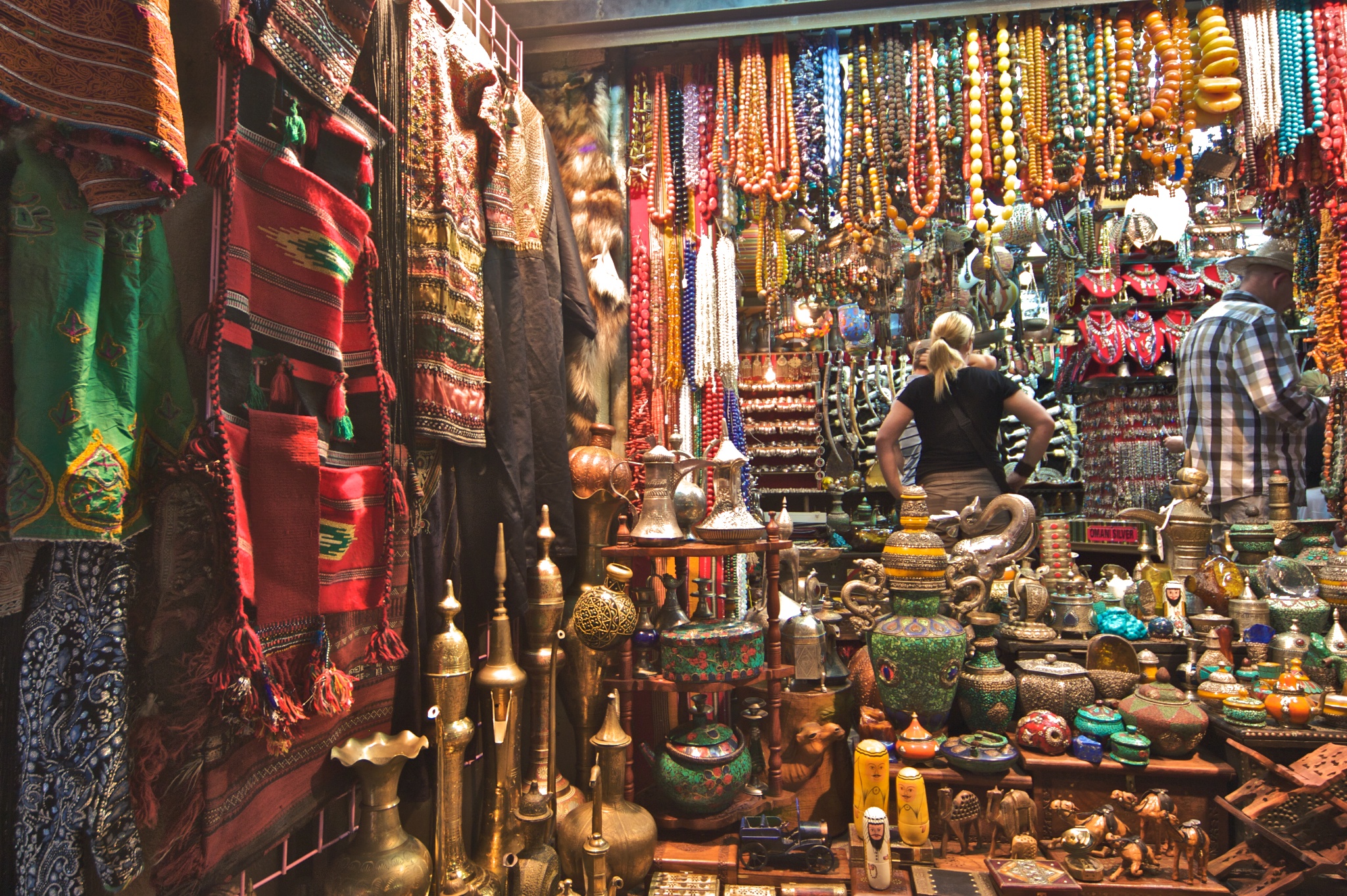 a woman looks at a display of jewelry