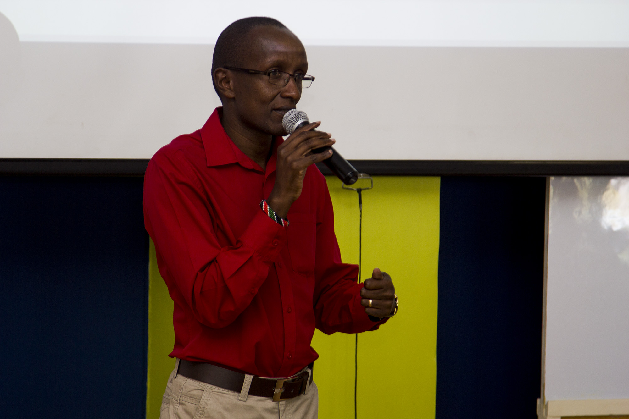 a man standing in front of a microphone