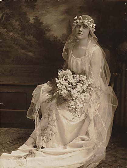 an old po of a woman dressed in a wedding gown