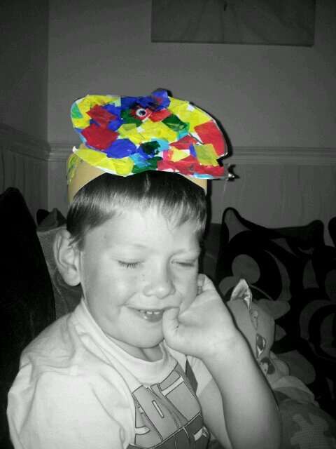 a young child wearing a gummy bear hat