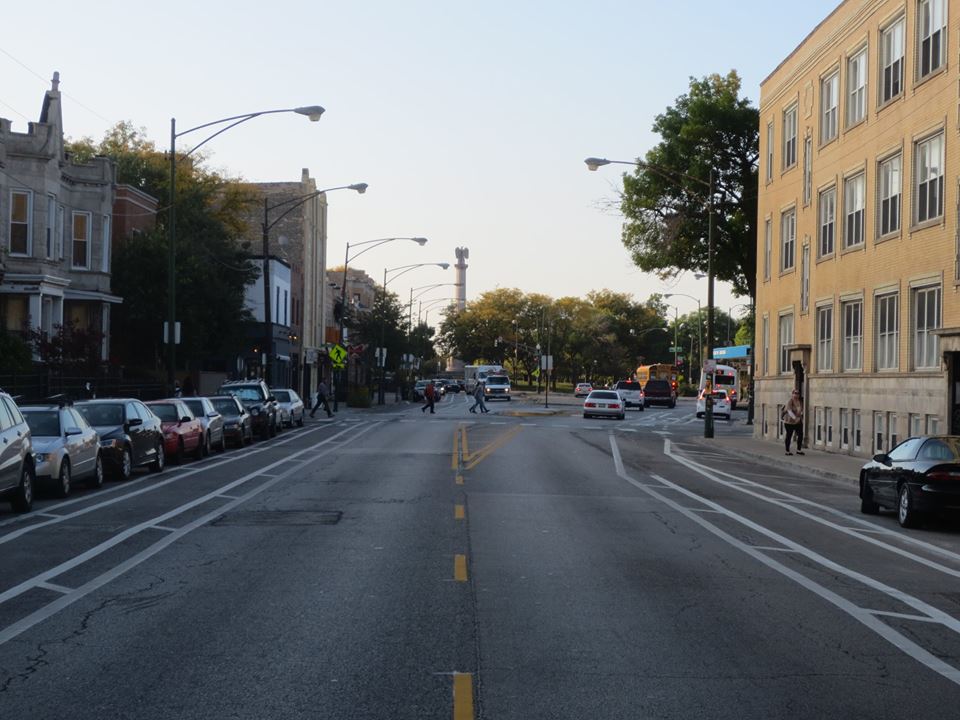 cars stopped in traffic on the city street