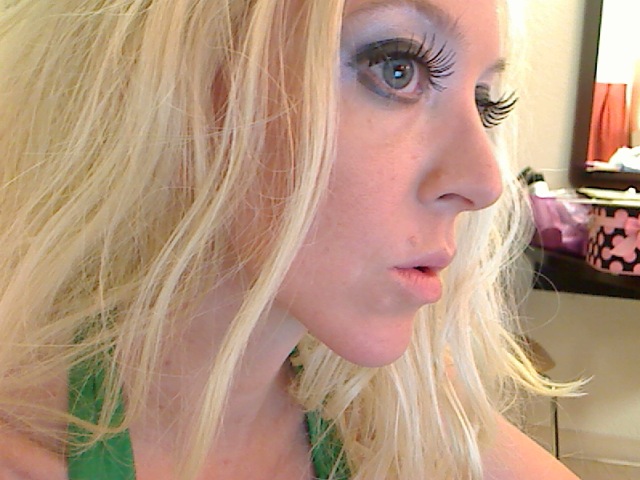 blond woman with eye lashes, looking to her left