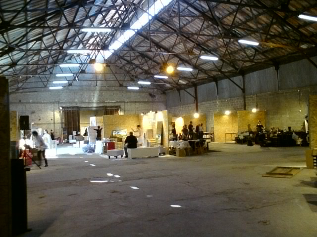 an open warehouse with people in the center