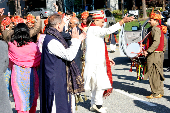 several men and one woman wearing traditional indian clothing