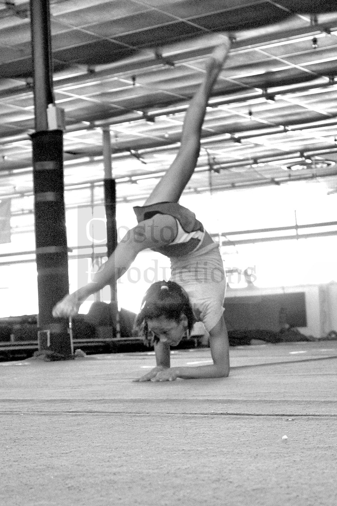 a man doing tricks on the floor in a gym