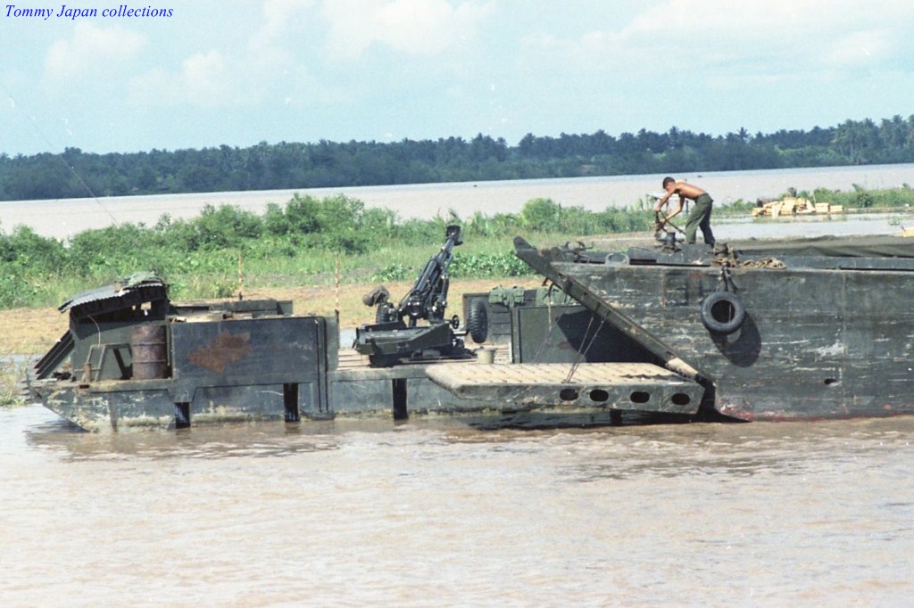 a barge with two men in it on the water