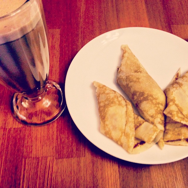 three pieces of crepe sitting on a white plate