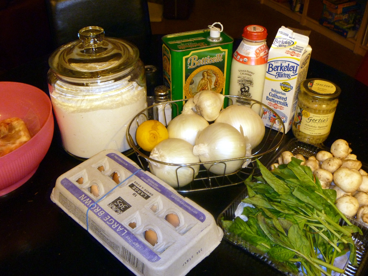 a table with eggs, cream, er, onion, and spinach