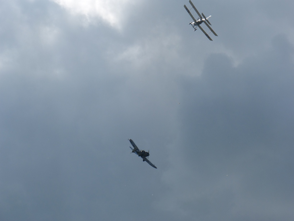 an airplane is flying with a fighter plane