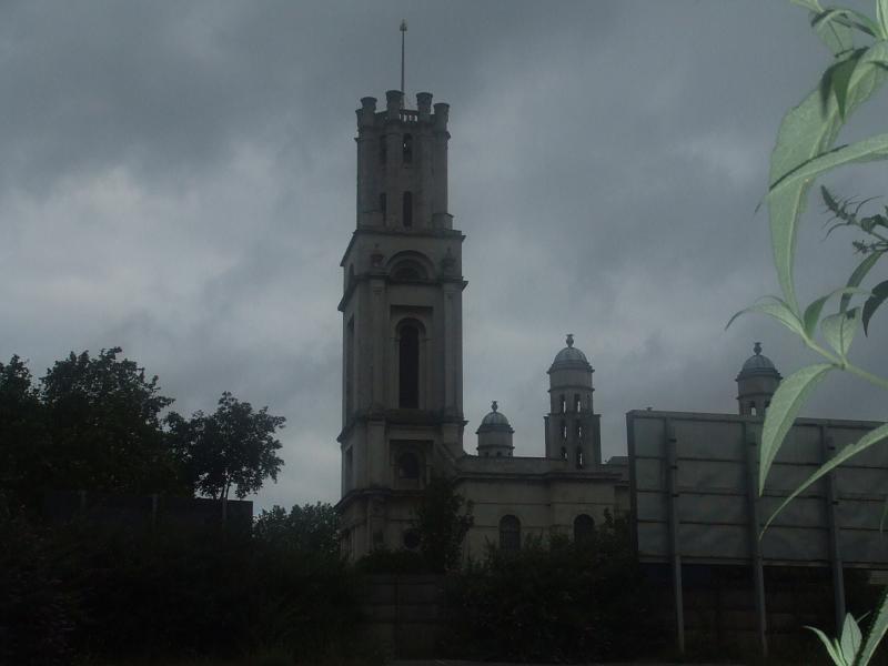 a tall clock tower against a cloudy sky