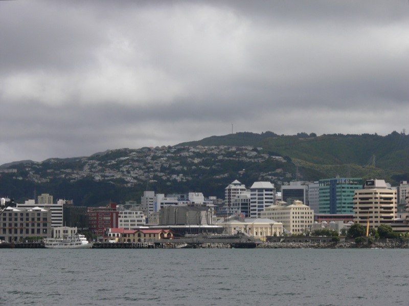 a city is shown from the water in this po