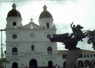 the statue is in front of the church
