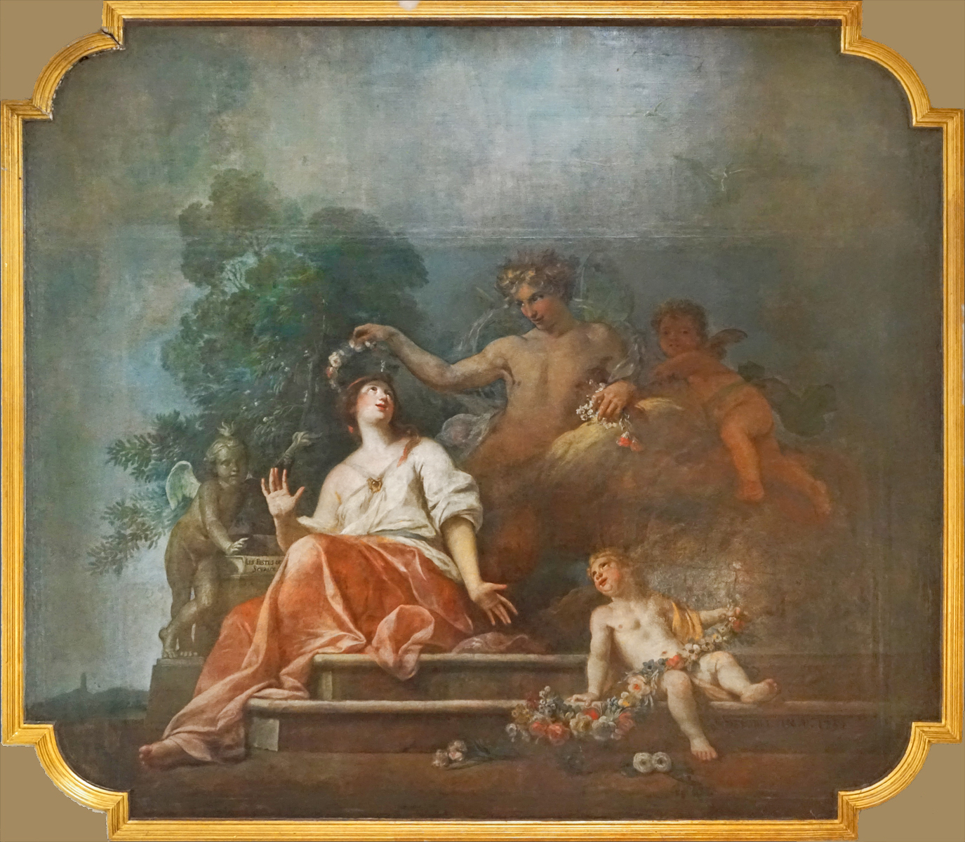 painting on wall of a woman laying down and man holding two cups