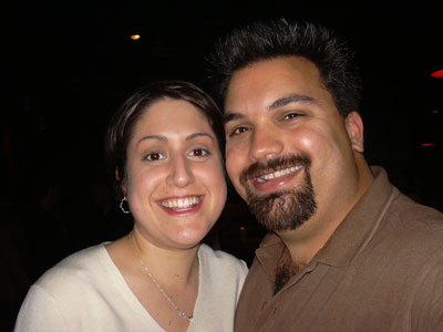 two people smiling at an event together