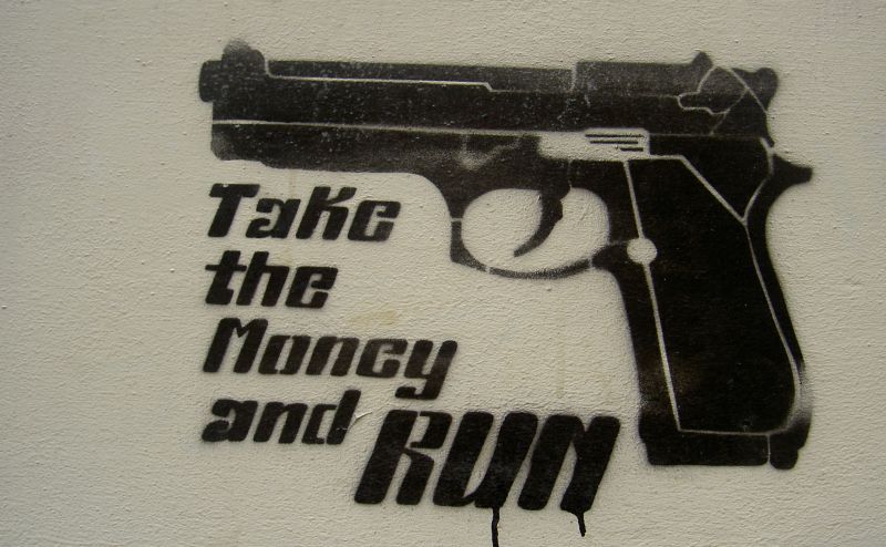 a black and white painting on the wall showing a gun