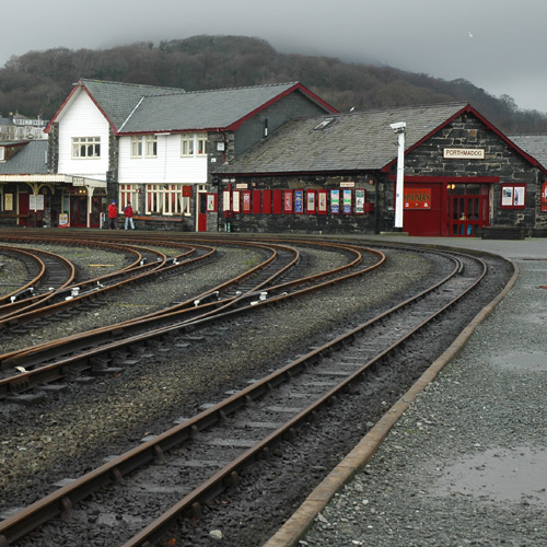 a train station with some tracks going by