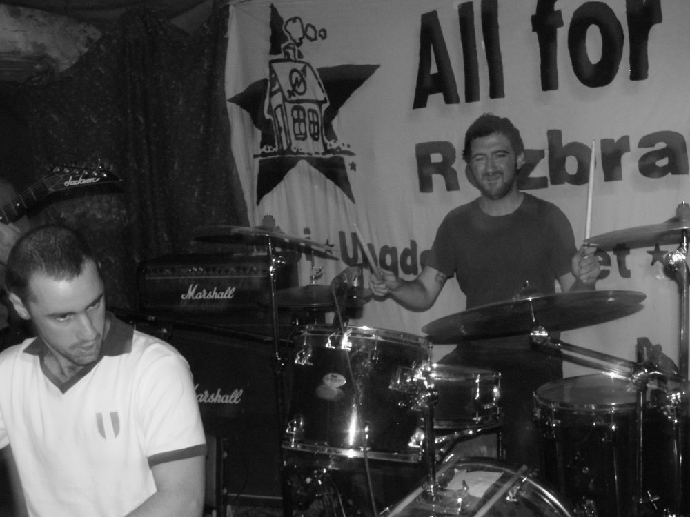 black and white pograph of a man playing drums