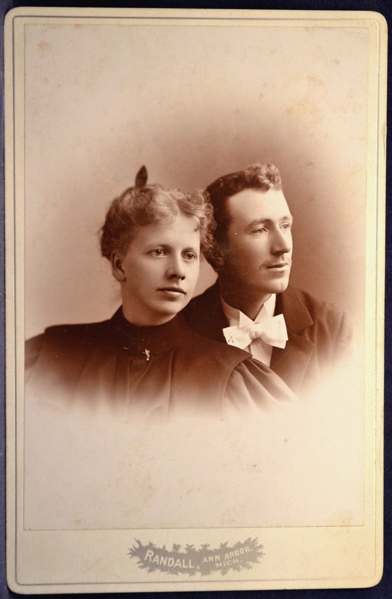 an old po of two people posing for the camera